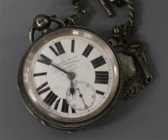 A late Victorian silver pocket watch, on a silver albert chain.